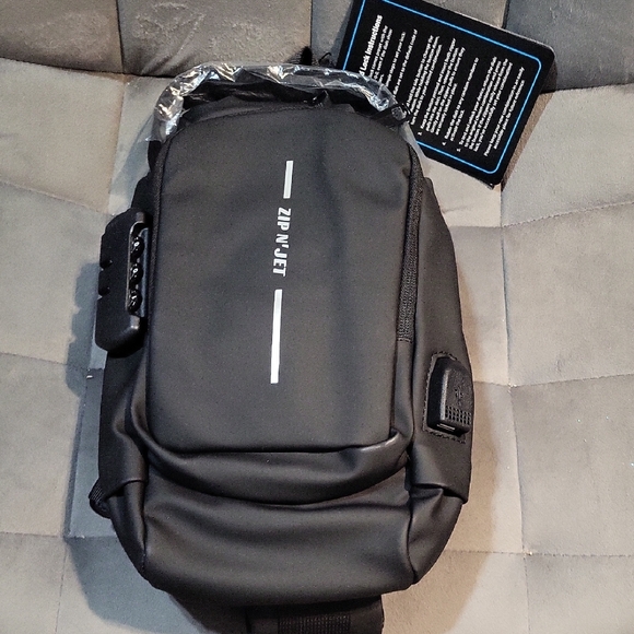 Zip and Jet Black Belt Bag with Streamlined Design and Water-Resistant Material - Picture 1 of 6